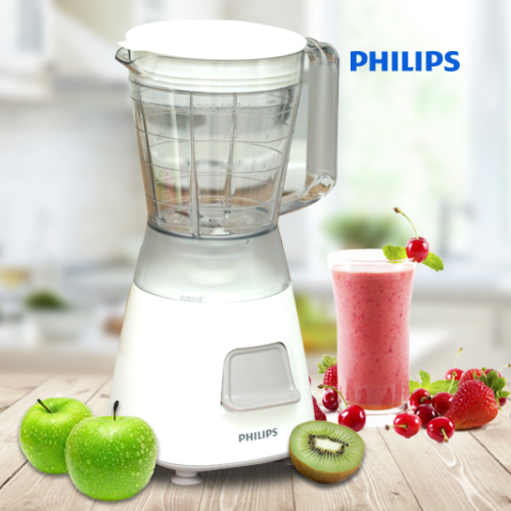 Blender in a background that surounded by its own made fruit juice