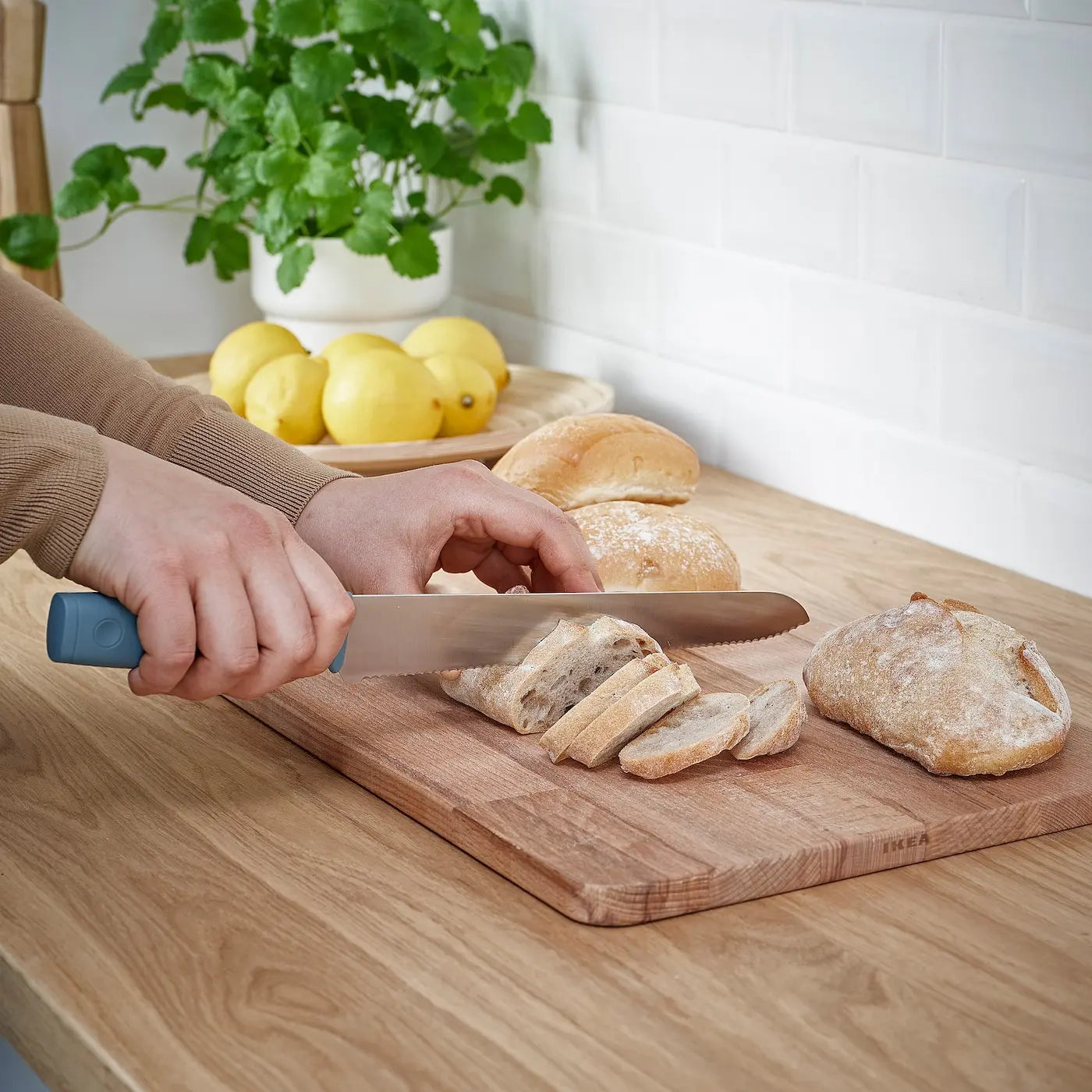 Using large kitchen knife to cut a  meat and doing that work easily